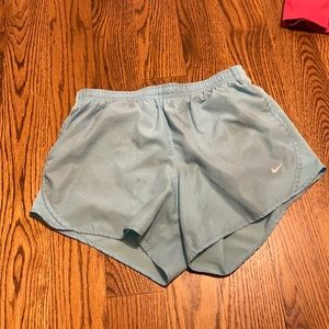 Blue nike shorts.
